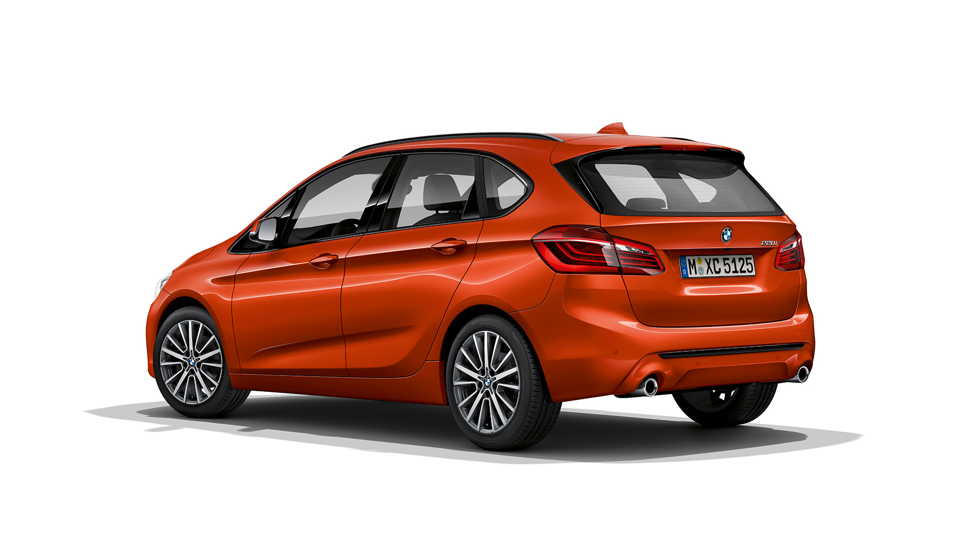 Three-quarter rear view BMW 2 Series Active Tourer Model Sport Line BMW 2 Series Active Tourer Model Sport Line 220i F45 2018 Sunset Orange metallic three-quarter rear view