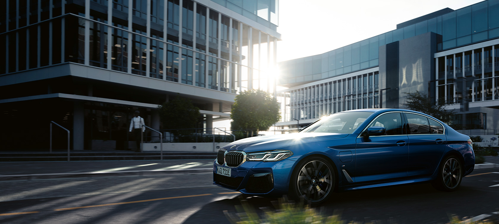 BMW 5 Series Sedan G30 driving BMW 5 Series Sedan G30 Facelift 2020 Phytonic Blue three-quarter front view driving